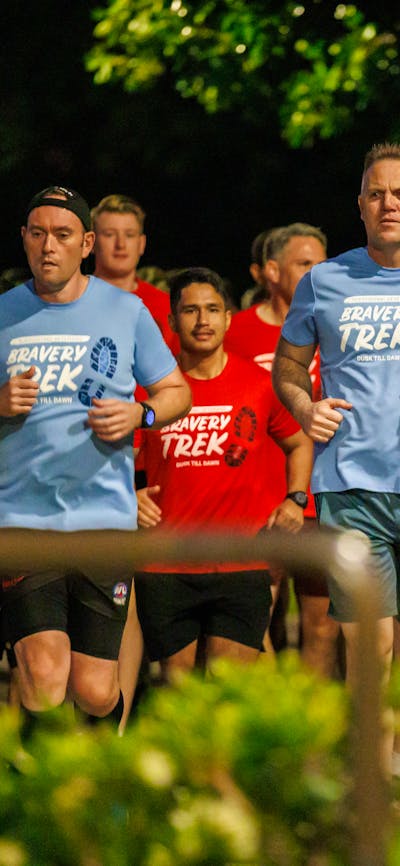 Group of people running in Dusk till Dawn tshirts