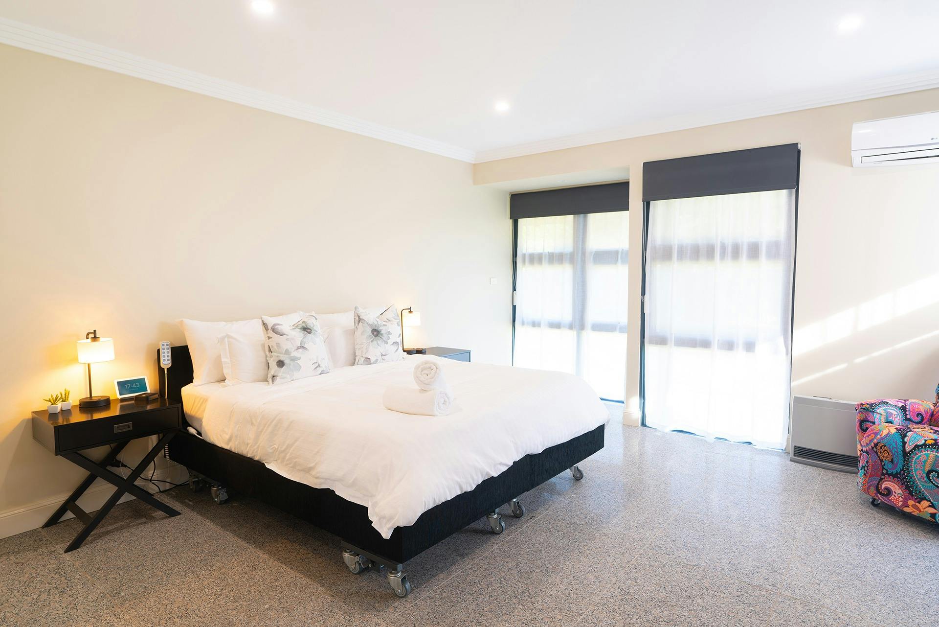 Suite 4 - accessible room with hi-lo bed on both sides, space around bed for a wheelchair.