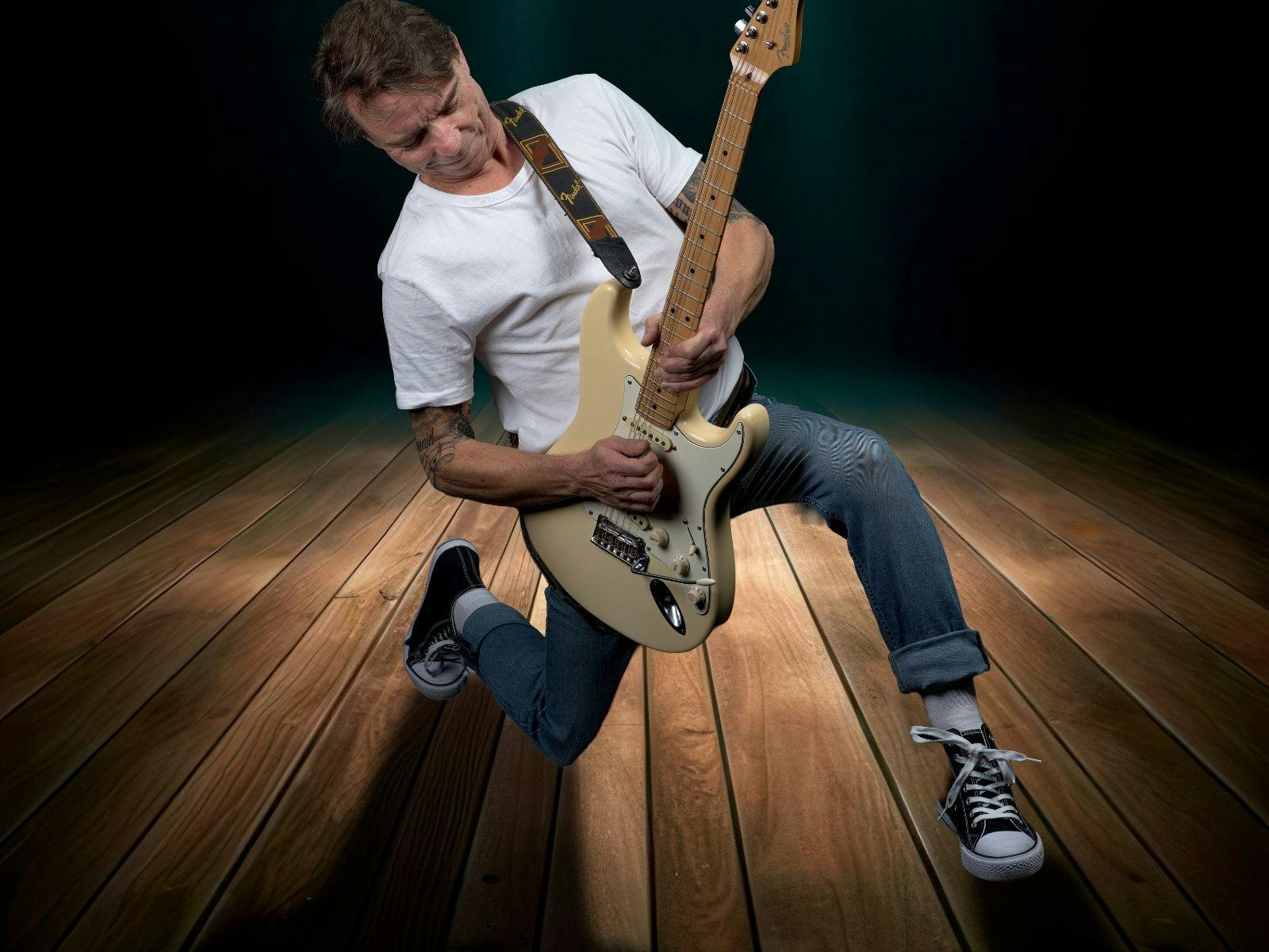 rick gauci performing with guitar