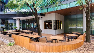 Outdoor cafe setting with wooden furniture