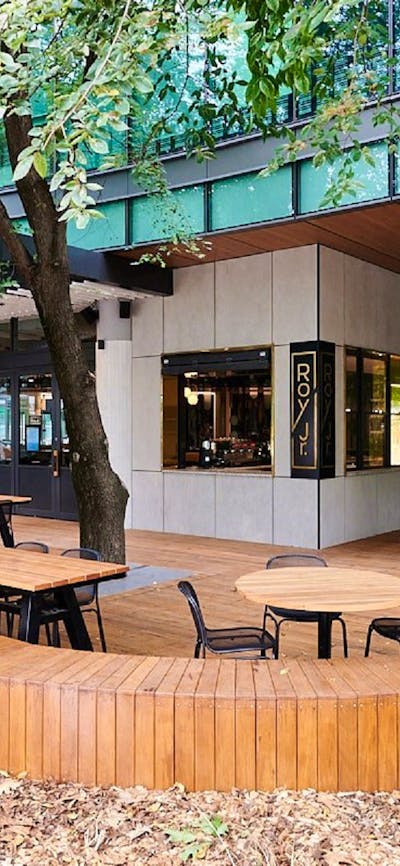 Outdoor cafe setting with wooden furniture