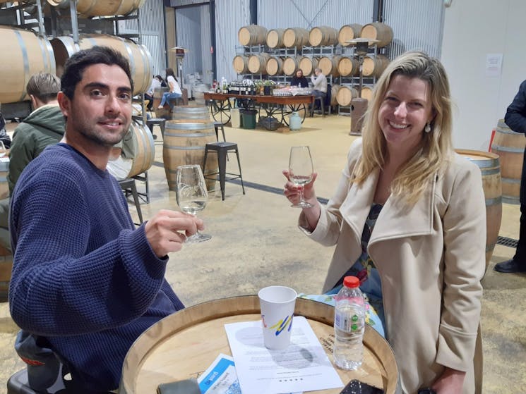 Couple enjoying wine tasting at Centennial Estate on a Kenny Escapes Wine Tasting Tour