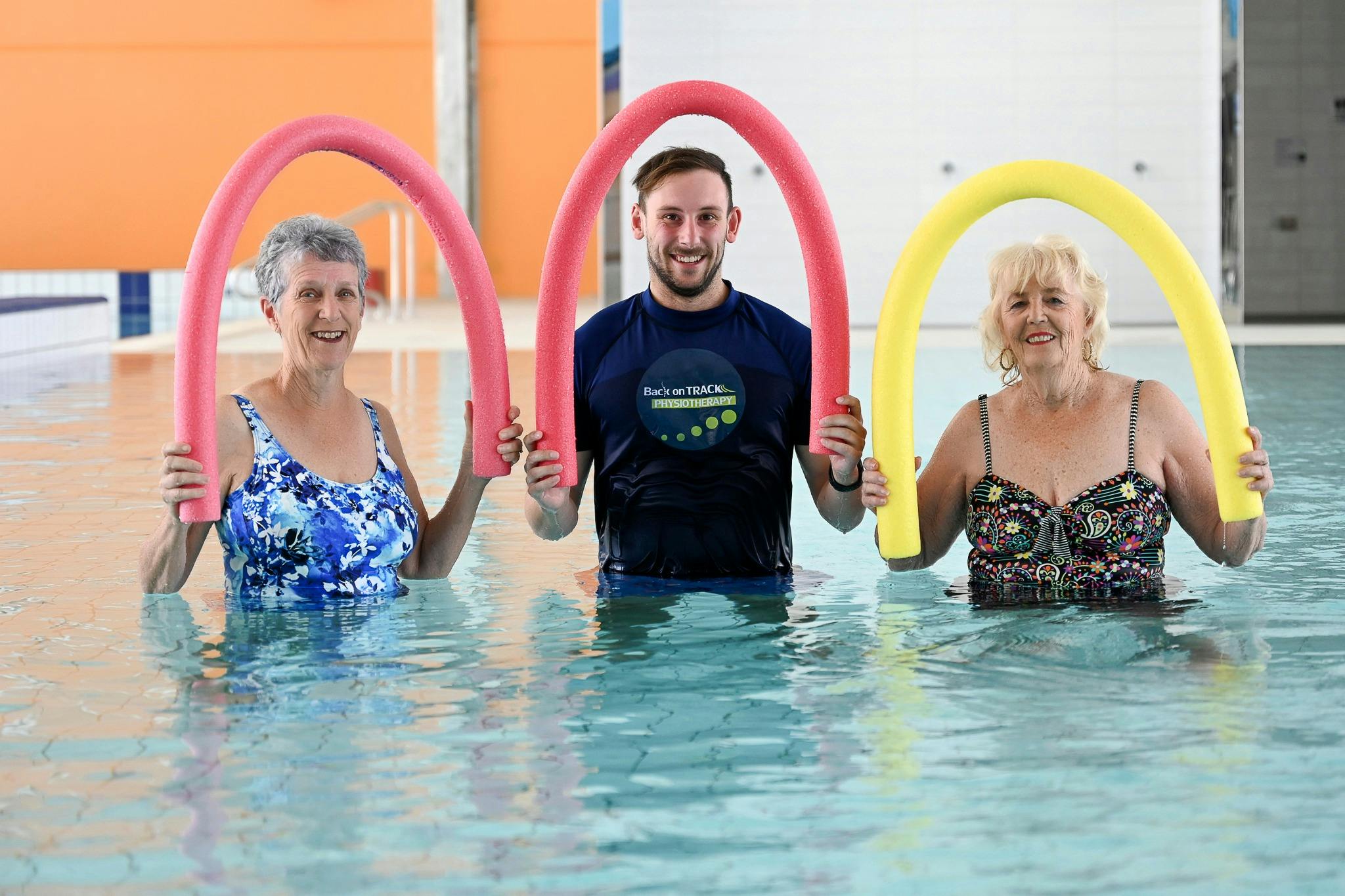 25m pool physiotherapy with noodles over head