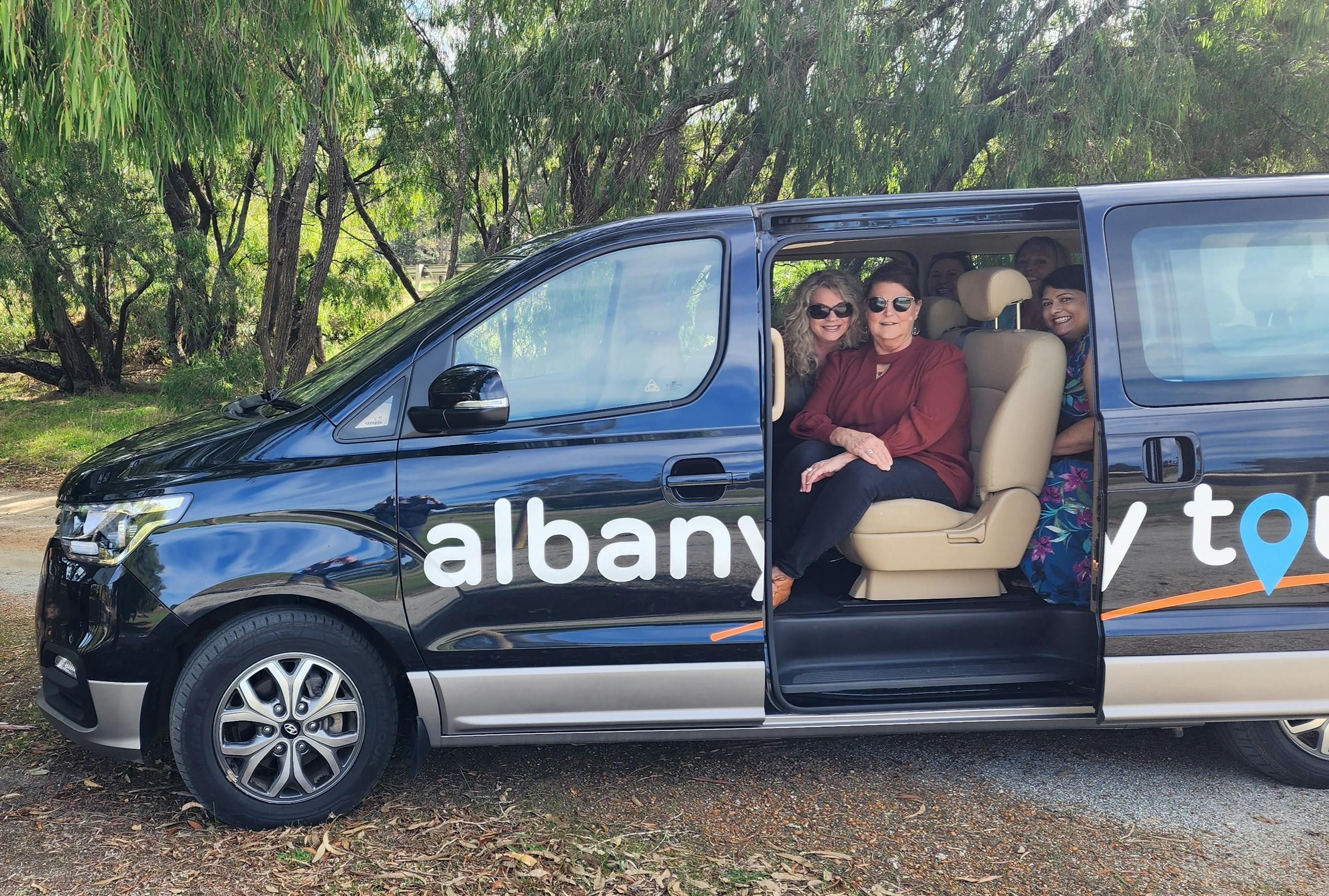 women sitting in a van