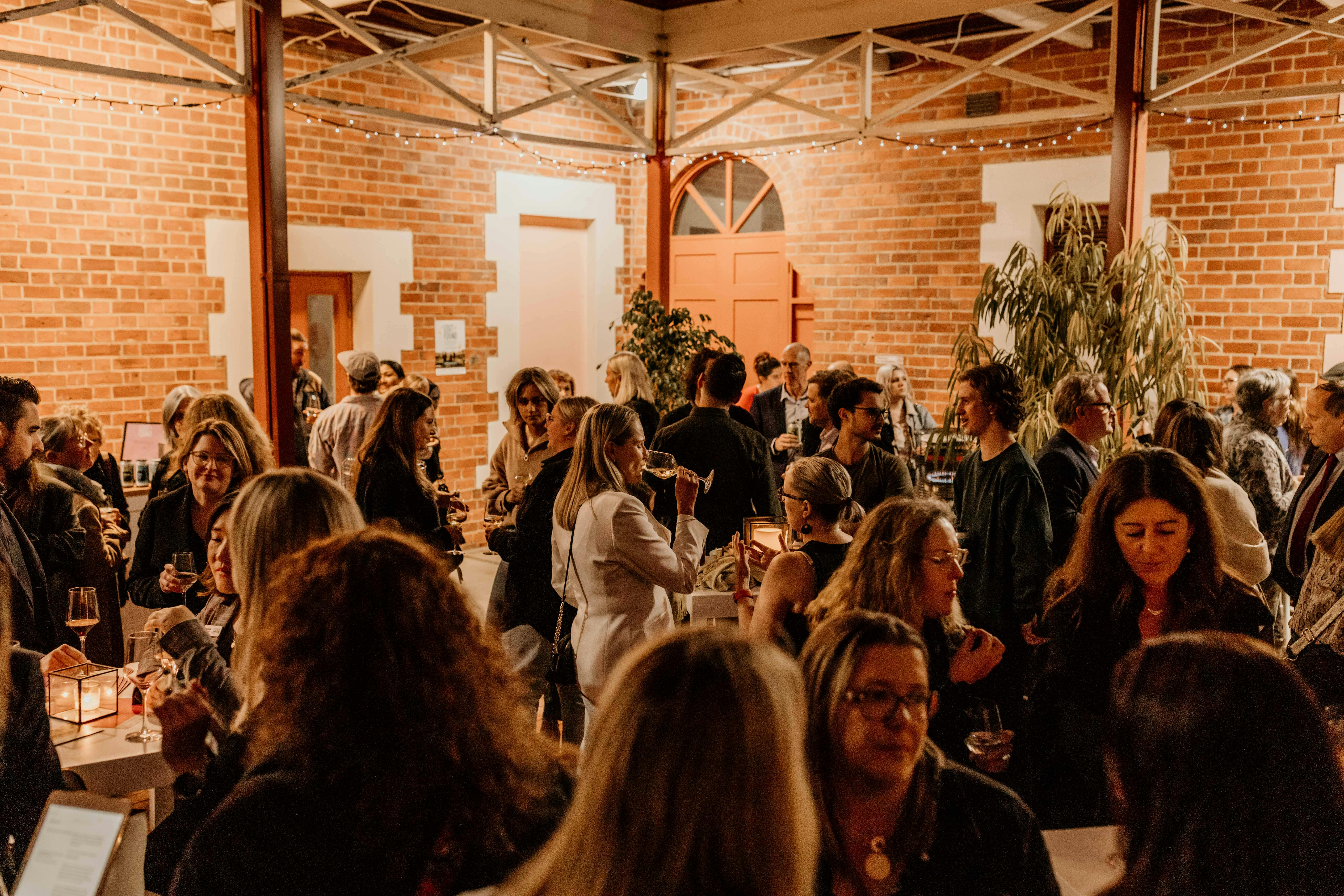 A crowd of people at an evening event