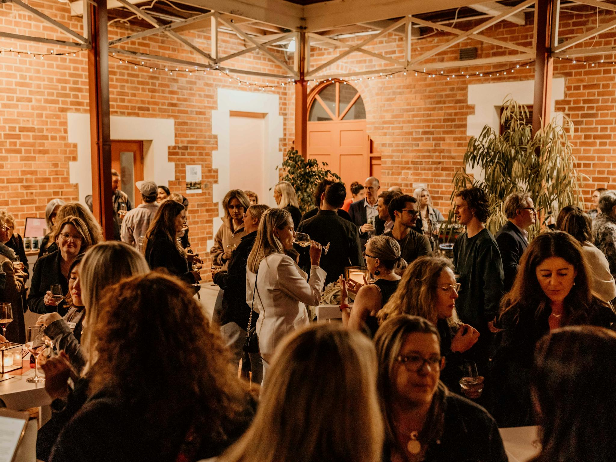 A crowd of people at an evening event