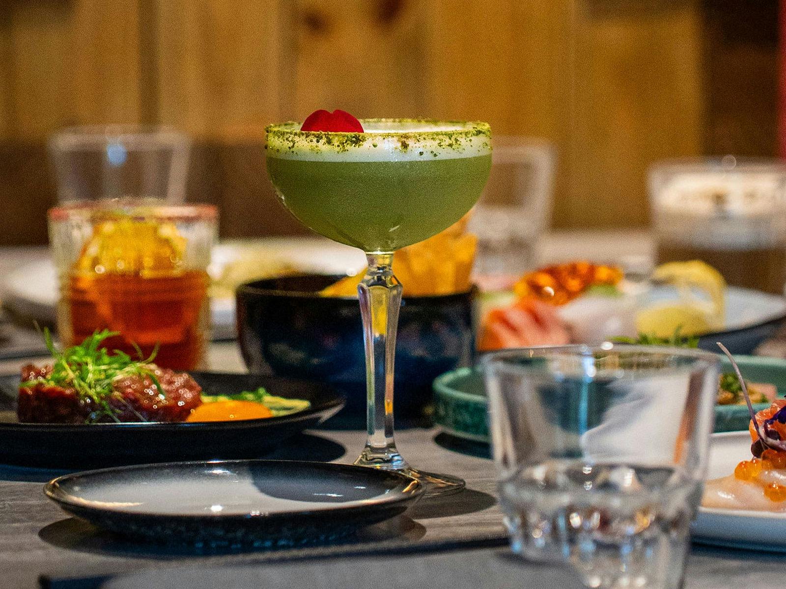 Dinner & cocktail spread on the table at KOI Bar & Restaurant.