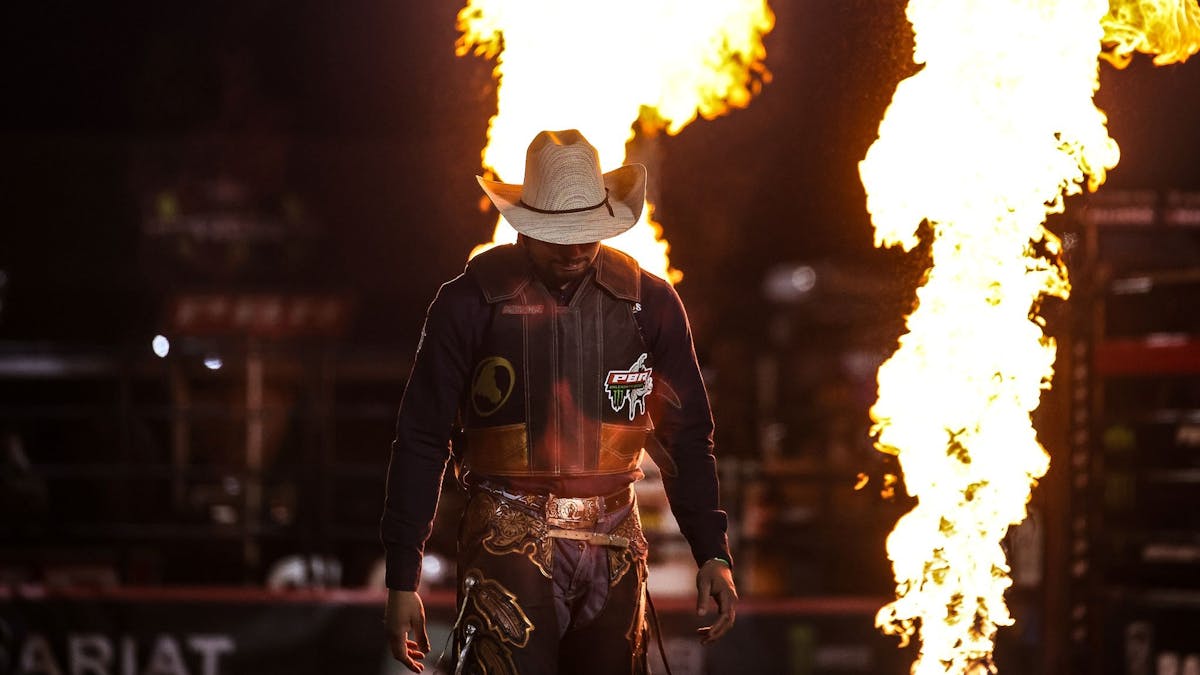 PBR cowboy walking into arena