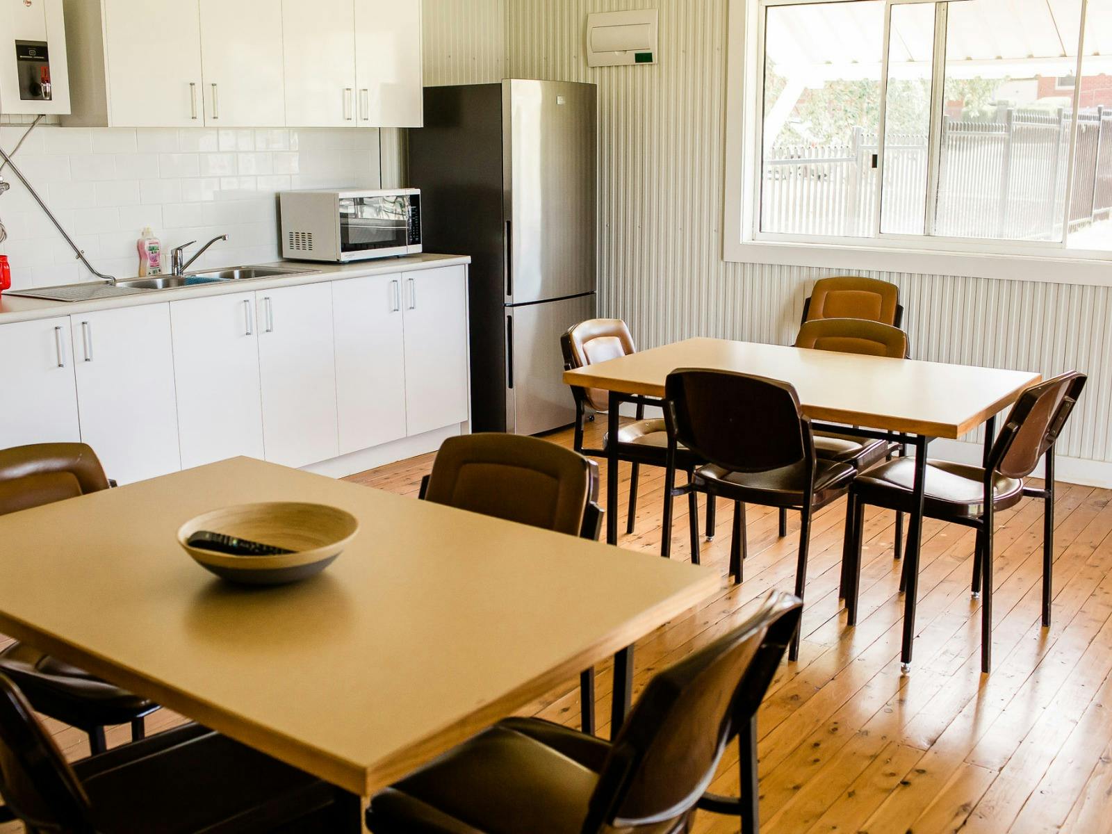 Camp kitchen with tables and kitchen area