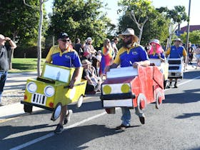 Members of Twin Rivers 4x4 Club dressed in cardboard cars participating in the parade