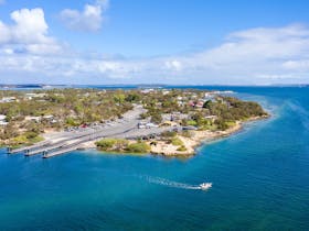 The Coffin Bay boat ramp. Car parking, toilets and a picnic area are available at this rest point..