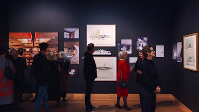 People exploring the Taglietti exhibition