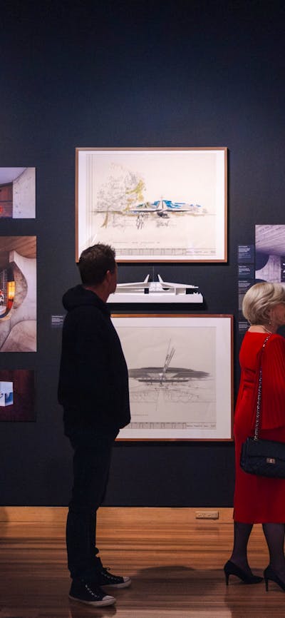 People exploring the Taglietti exhibition