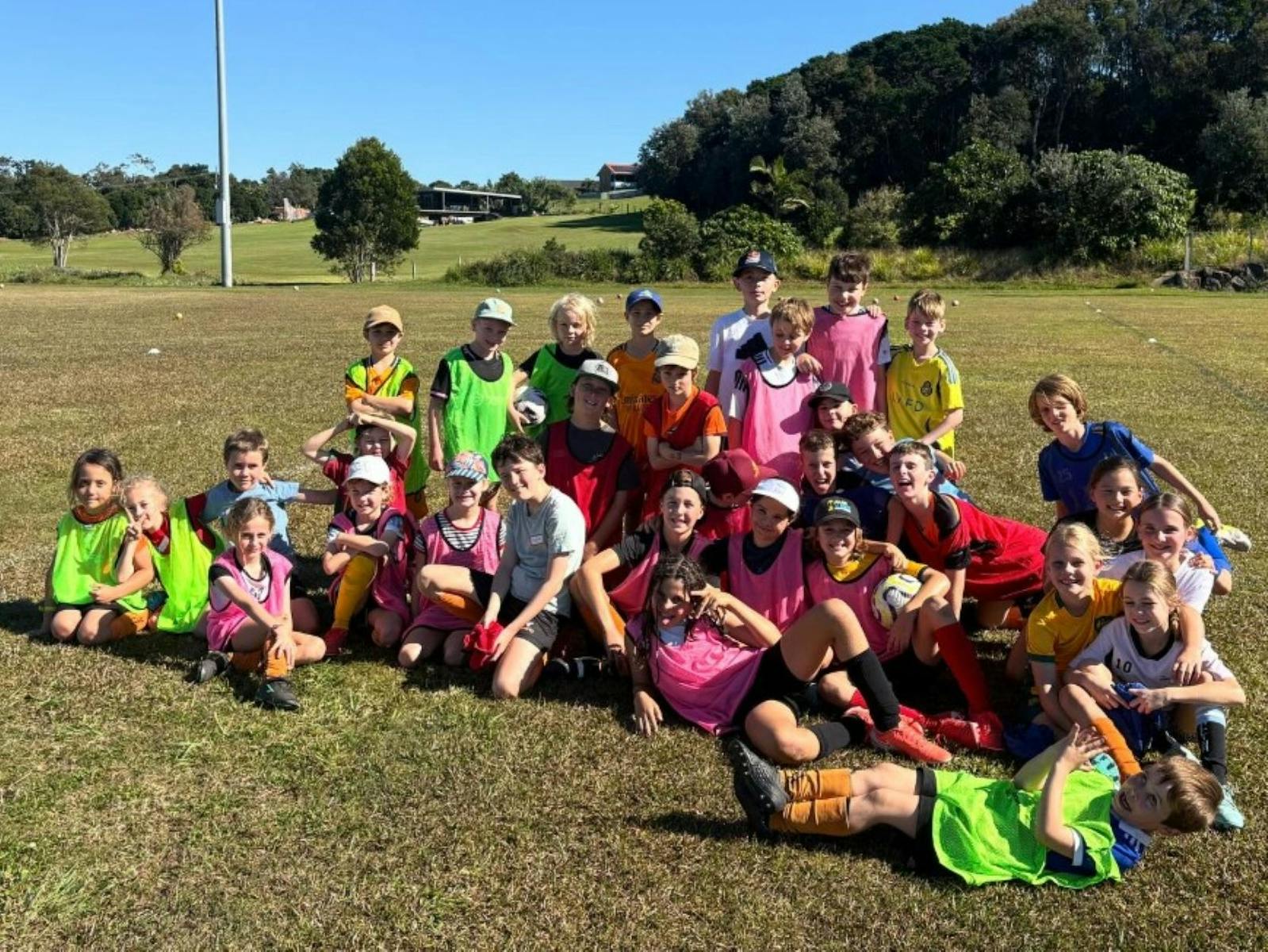 Group photo of kids on a field