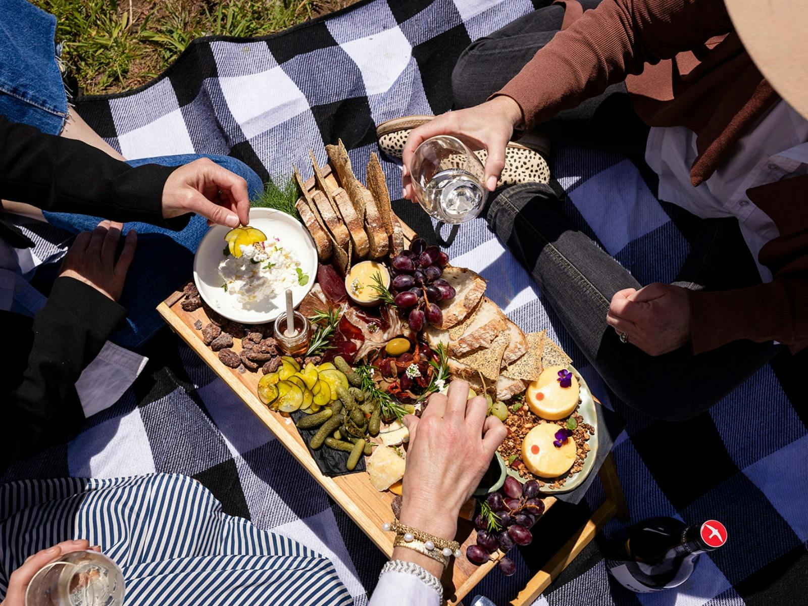 Printhie Wines Picnic Experience food on a portable tray table on a picnic rug