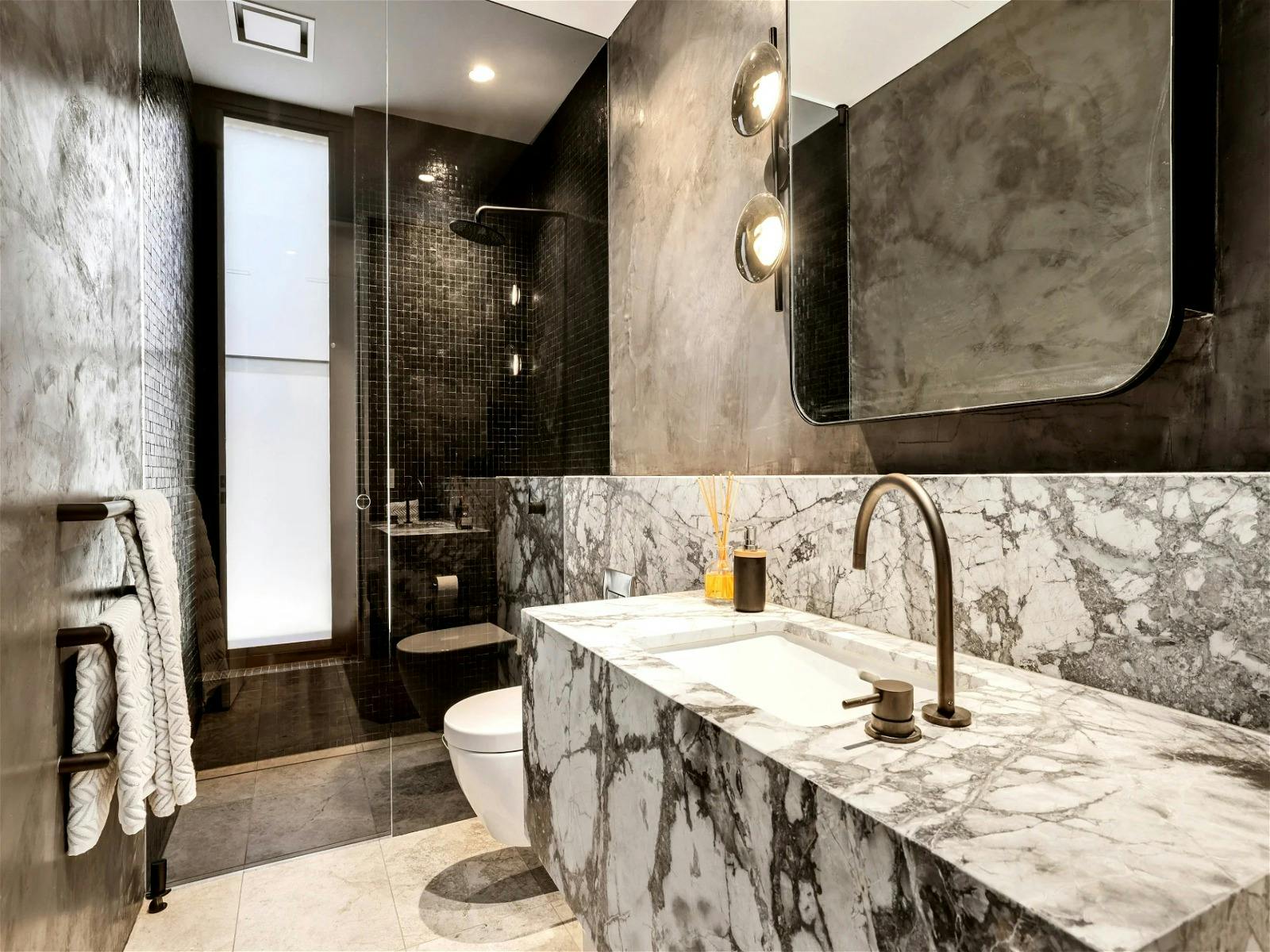 full ensuite with double basin and stone bathtub