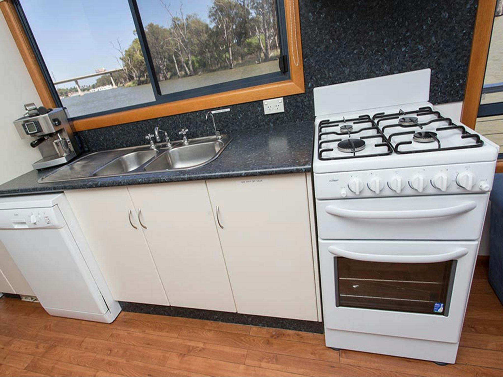 Margaylea's kitchen with full oven and dishwasher