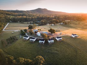 The sun rising over the property 6 luxury cabins on a 34-acre hobby farm.