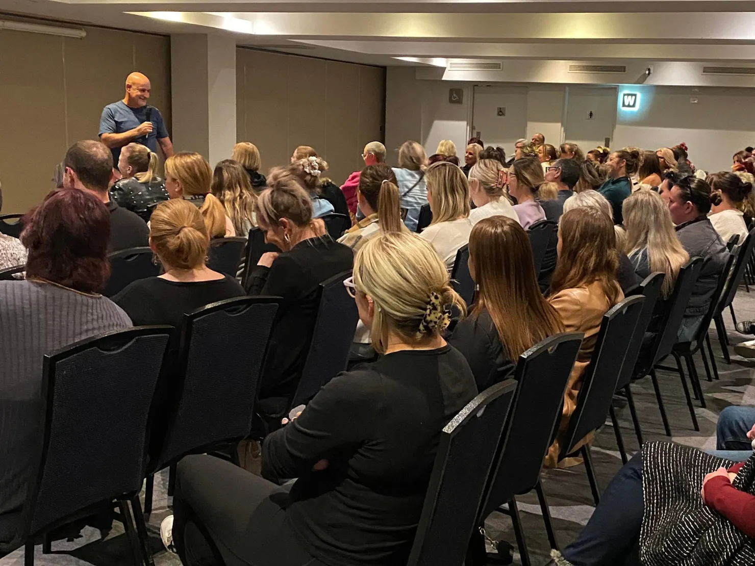 Aussie medium, Simon Hay doing a live mediumship event.