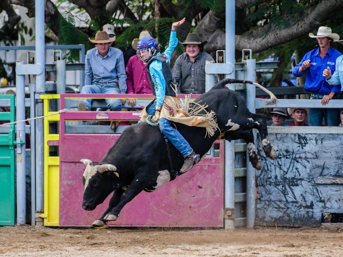 Girl on a bull at the Mareeba Rodeo in Mareeba Far North Queensland.