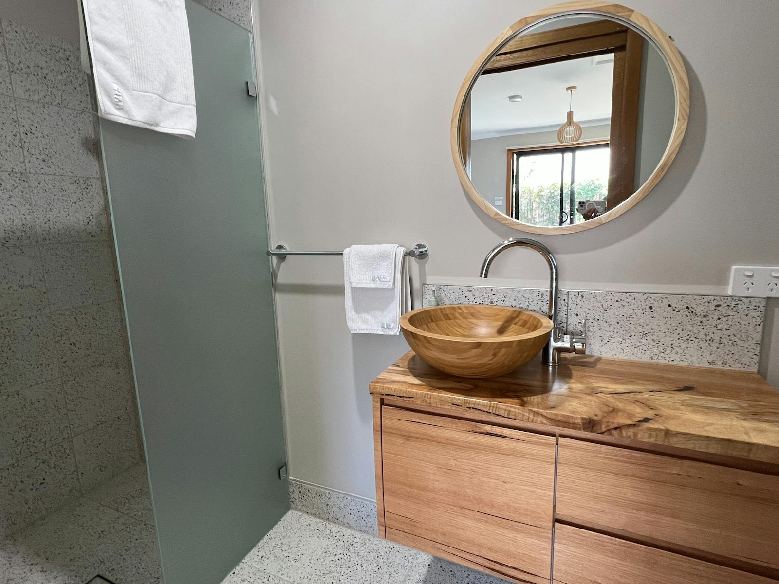 Shower, bamboo basin, mirror, vanity cabinet