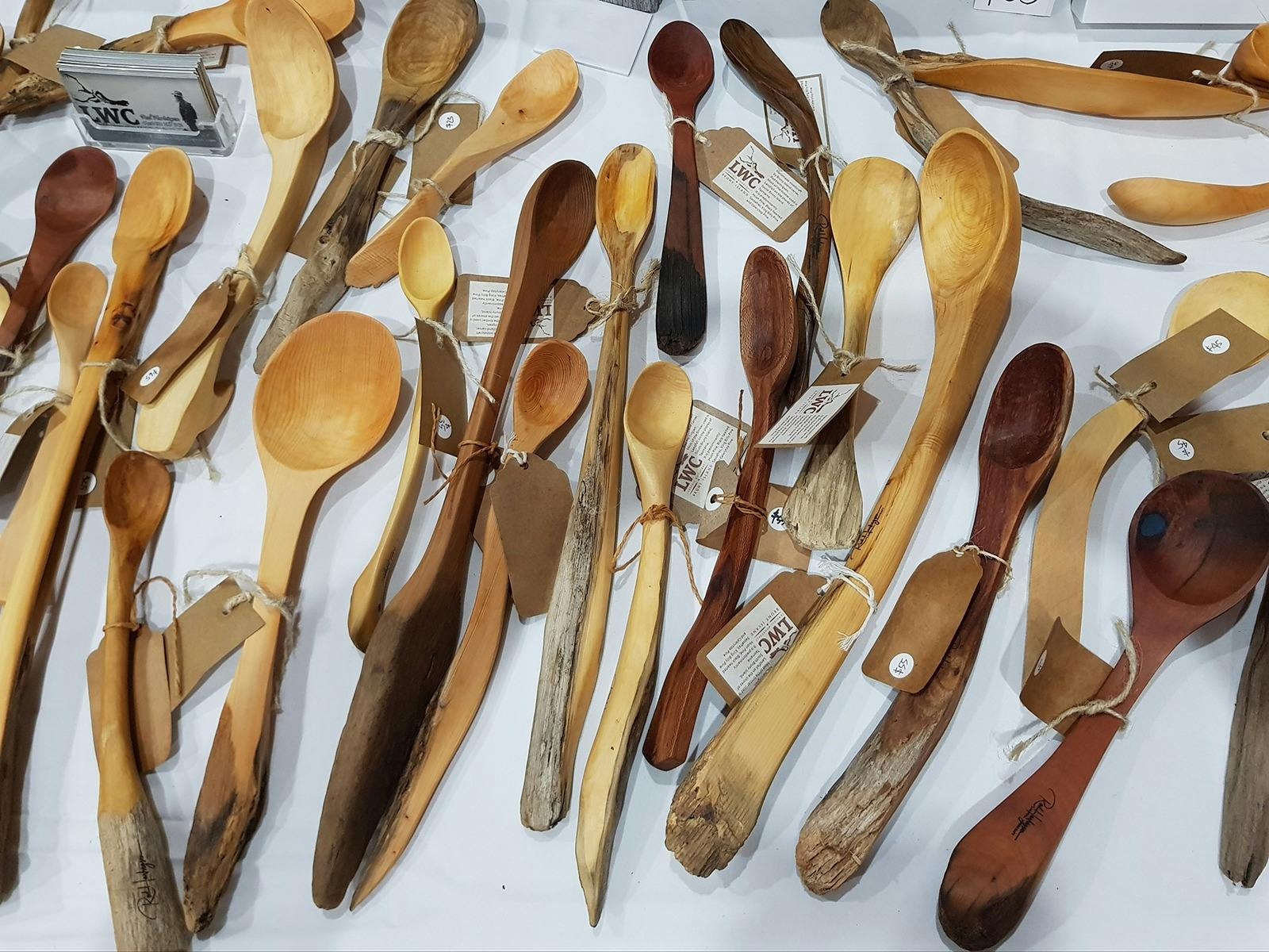 a variety of hand carved wooden spoons