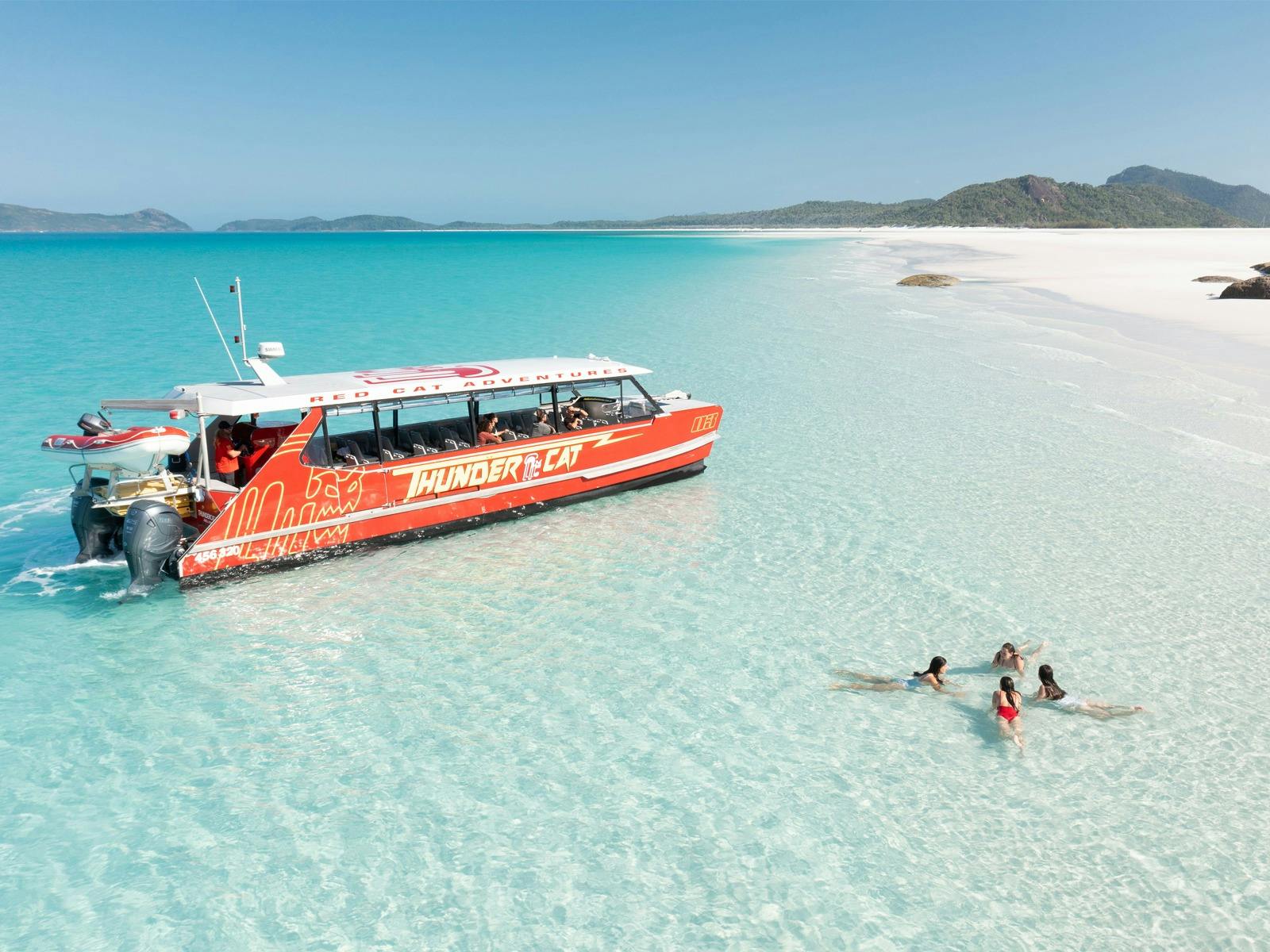 Red Cat Adventures - Thundercat Day Tour - Girls in Water at Whitehaven Beach