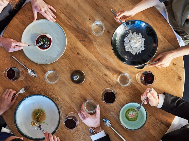 Friends enjoying food and drink at waterside restaurant LuMi Bar & Dining, Pyrmont