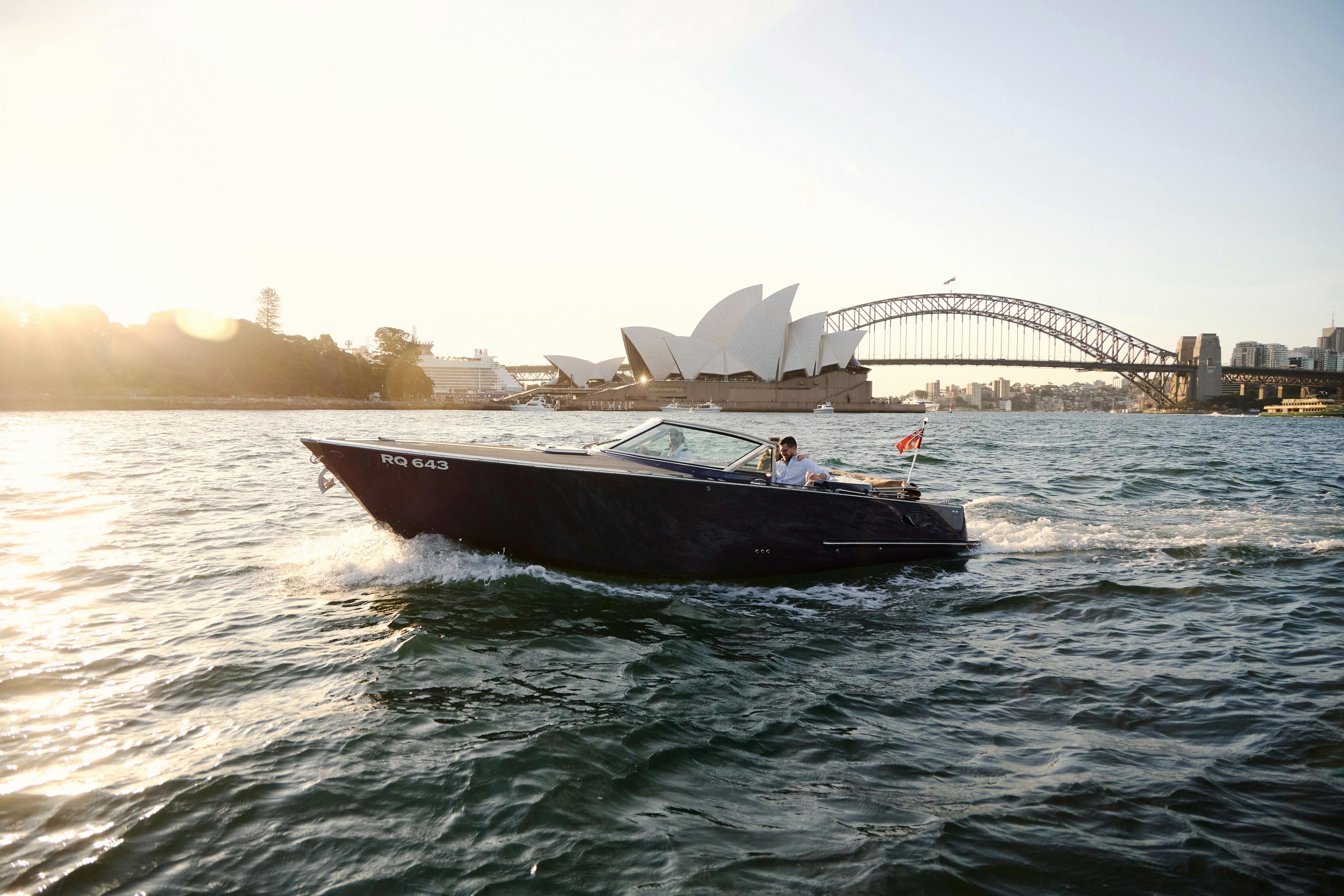 Private boat tour on MV Aquamajestic cruising Sydney Harbour with city skyline views.