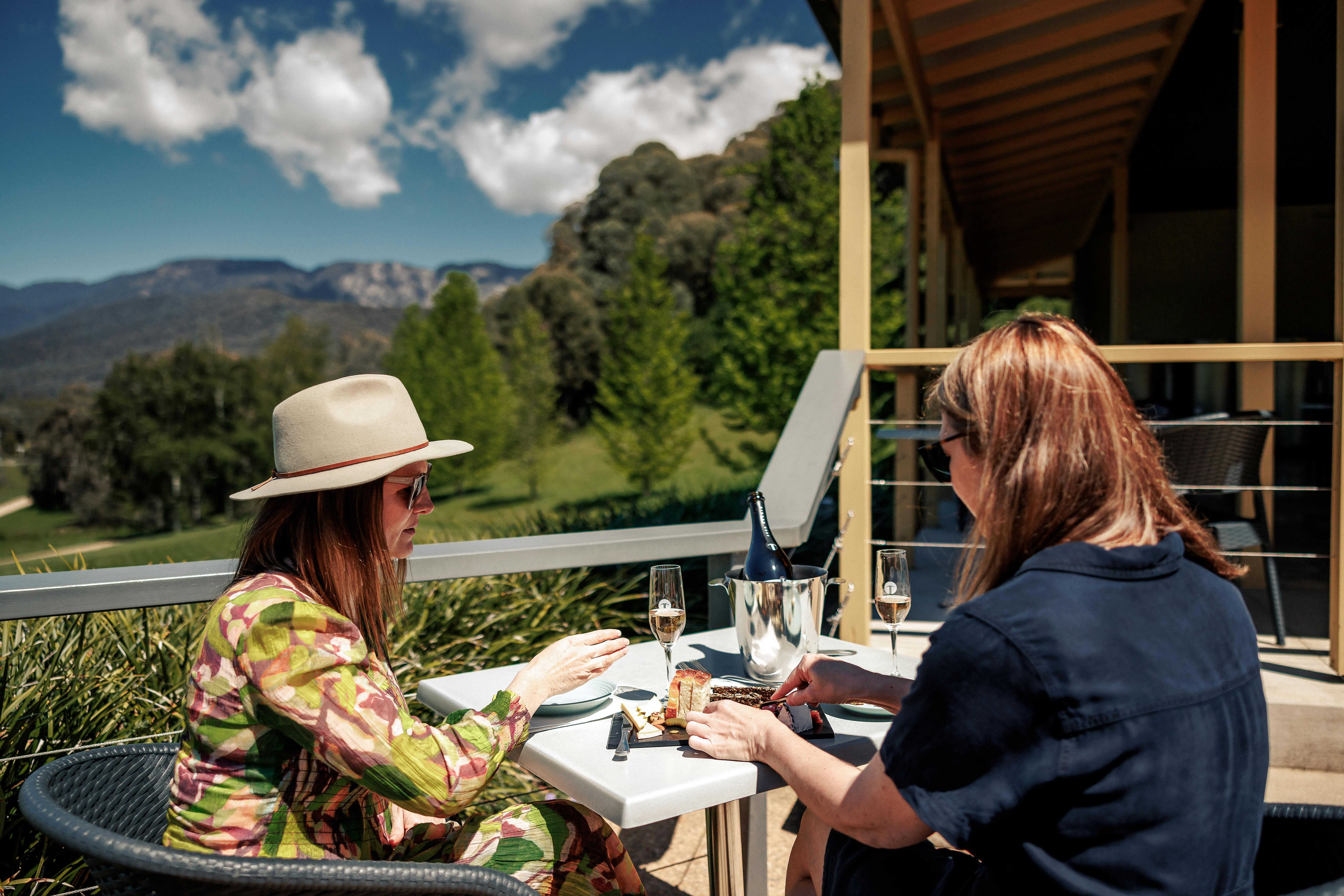 two women drinking wine at Ringer Reef Winery