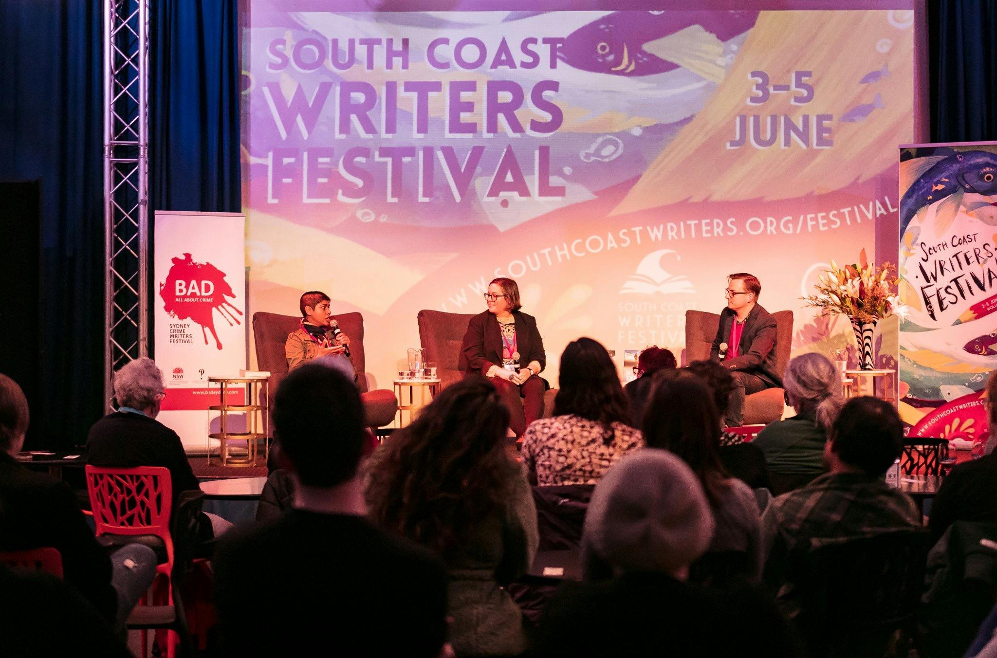 Hayley Scrivenor, Dinuka McKenzie and Andy Muir on stage during a panel