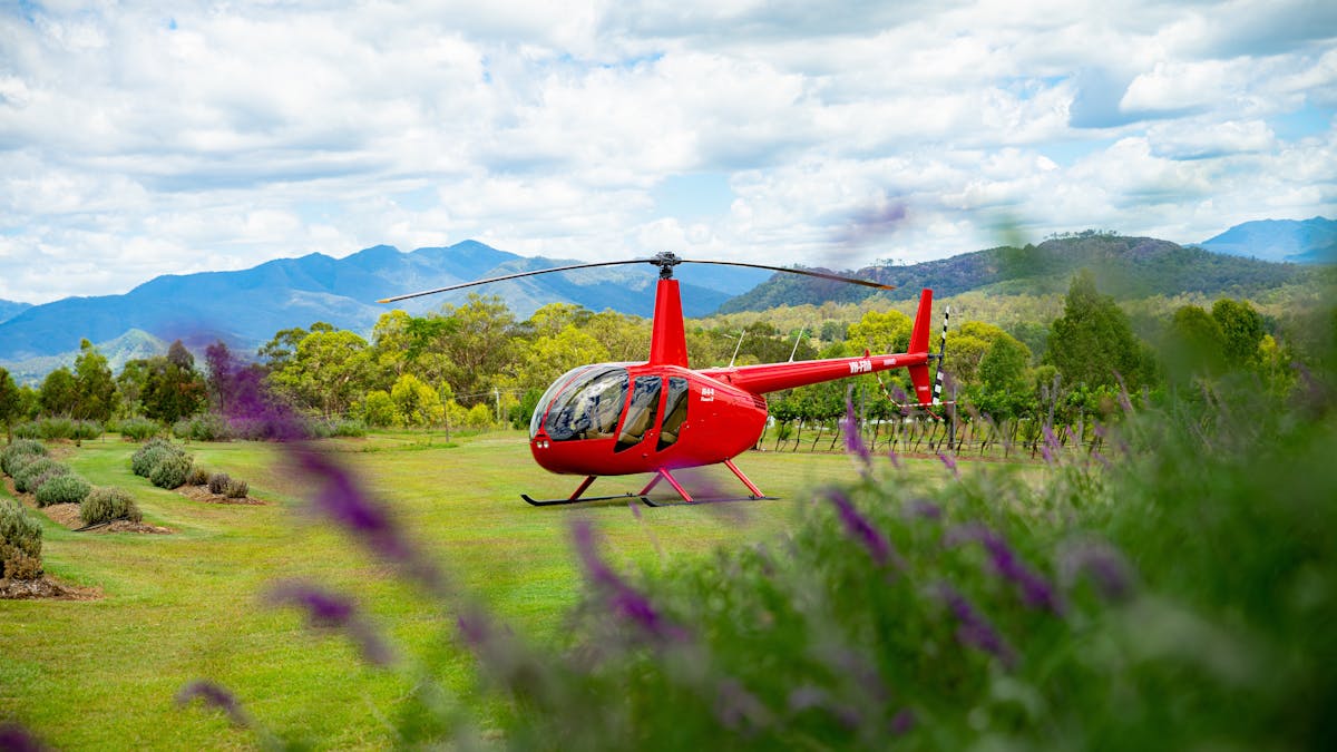 Our flagship Robinson 44 helicopter with full view glass doors at Kooroomba Lavender Farm.