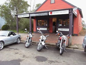 Precinct Galleries Shopfront with motorbikes and sports car
