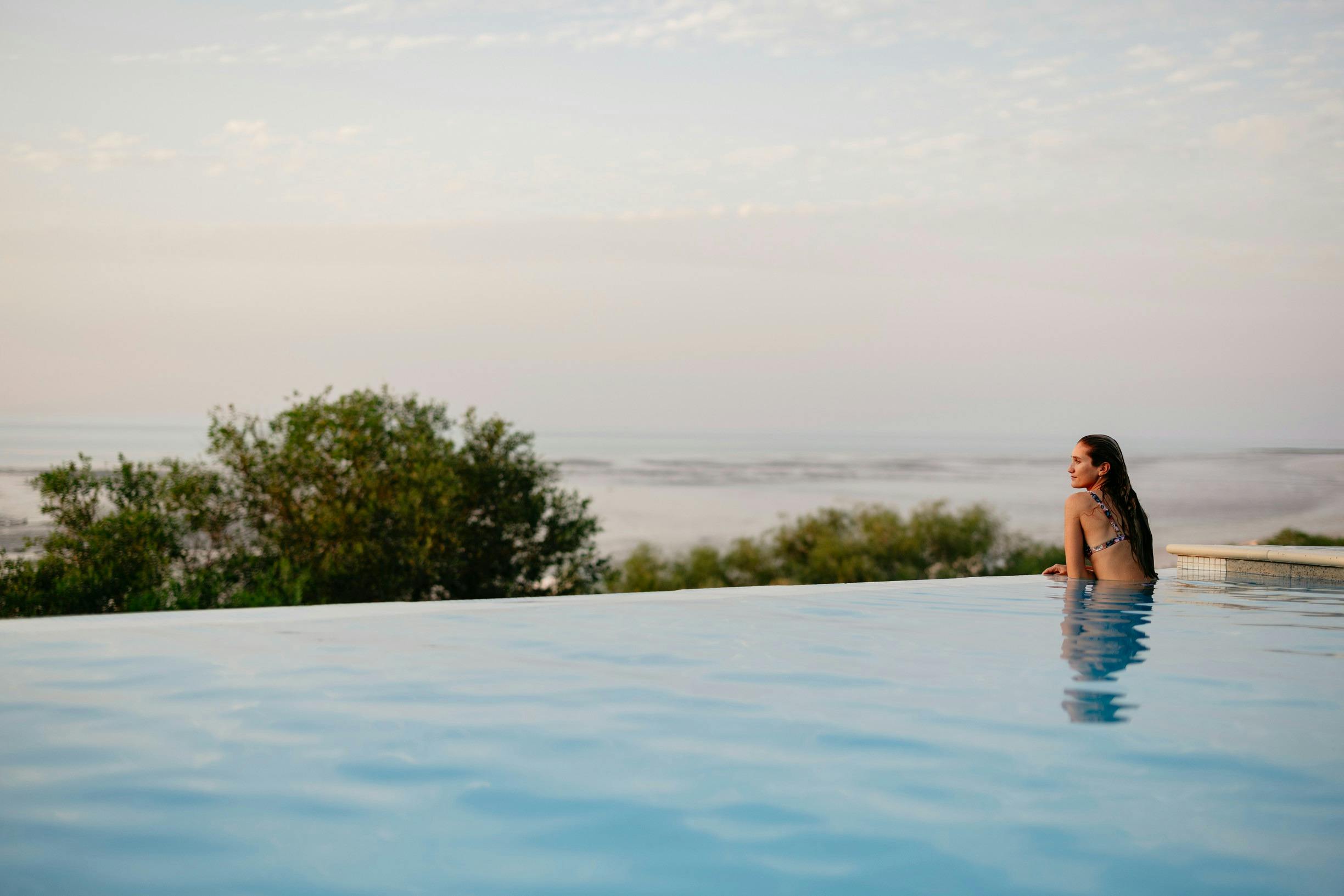 Person in infinity pool at Eco Beach Resort in Broome