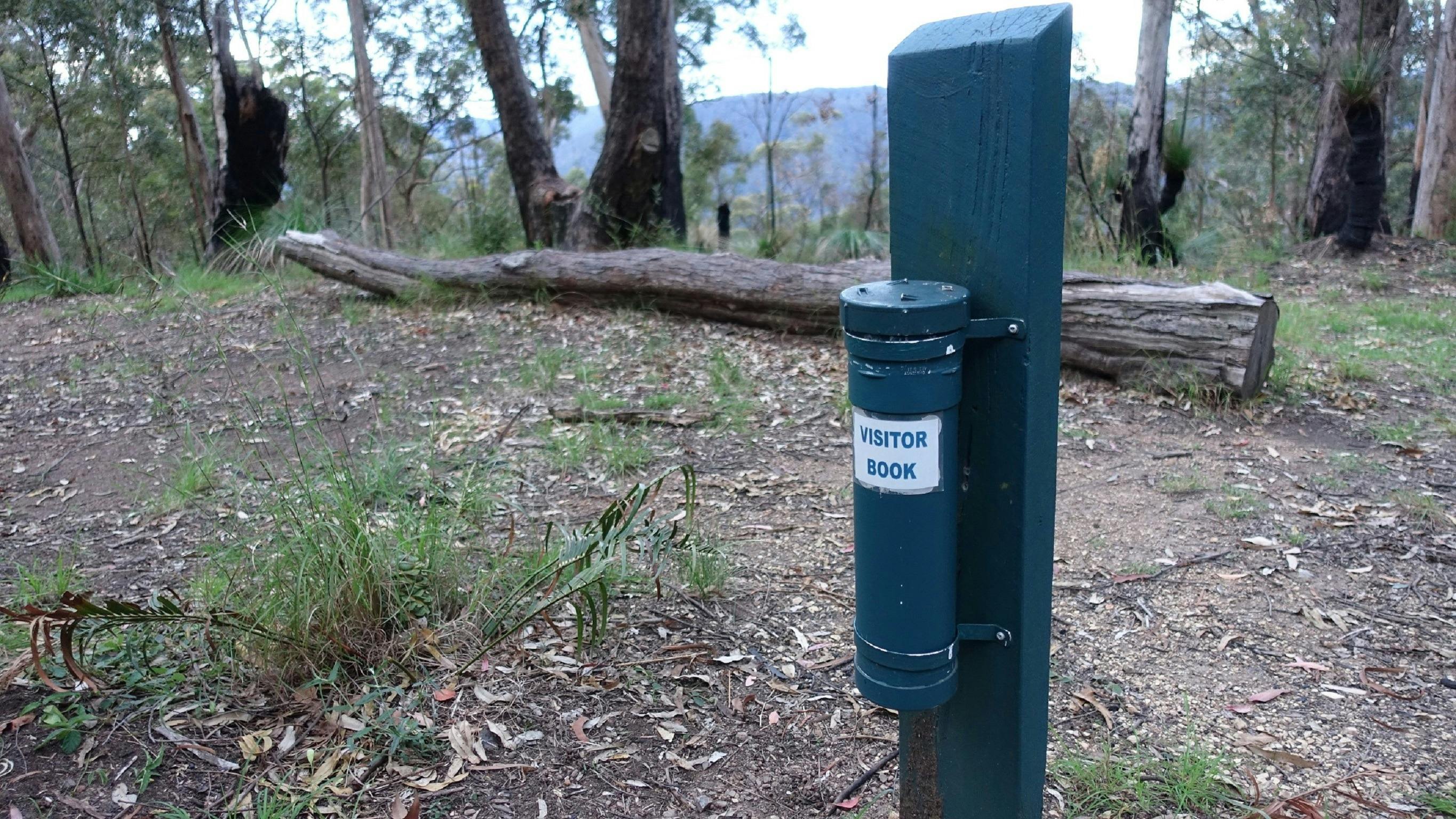 A post with the visitor book in Northbrook Mountain Bush Camp
