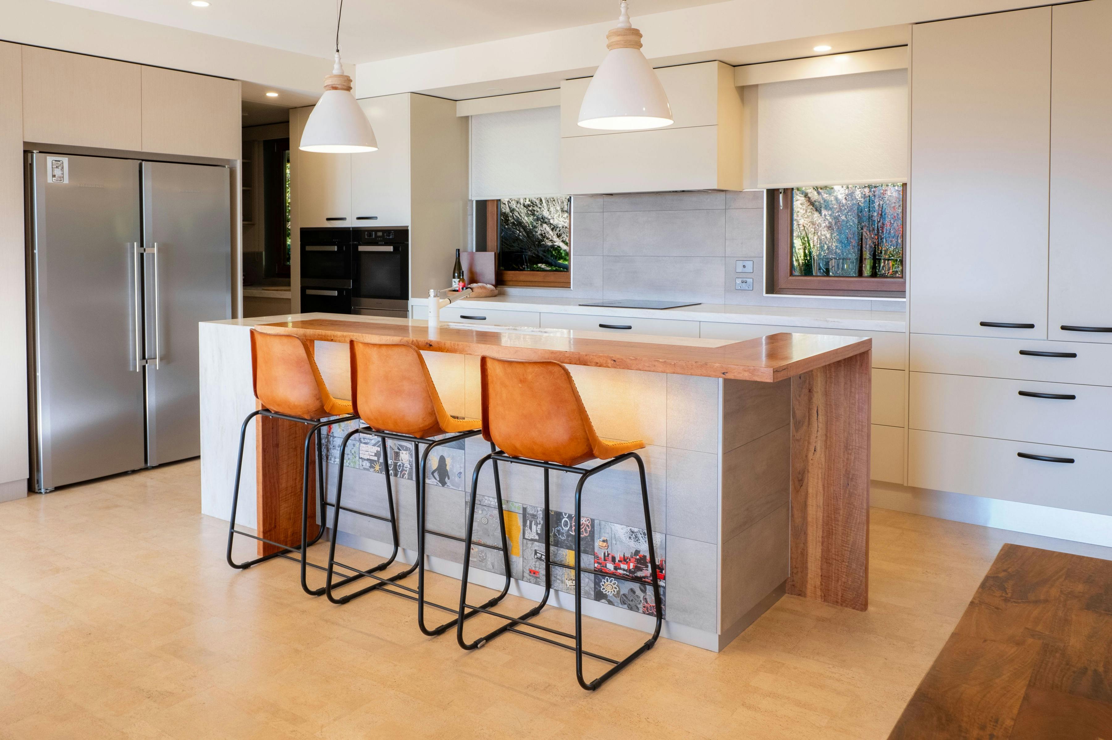 25 walkers lane kitchen with an island table and bar stools, refrigerator