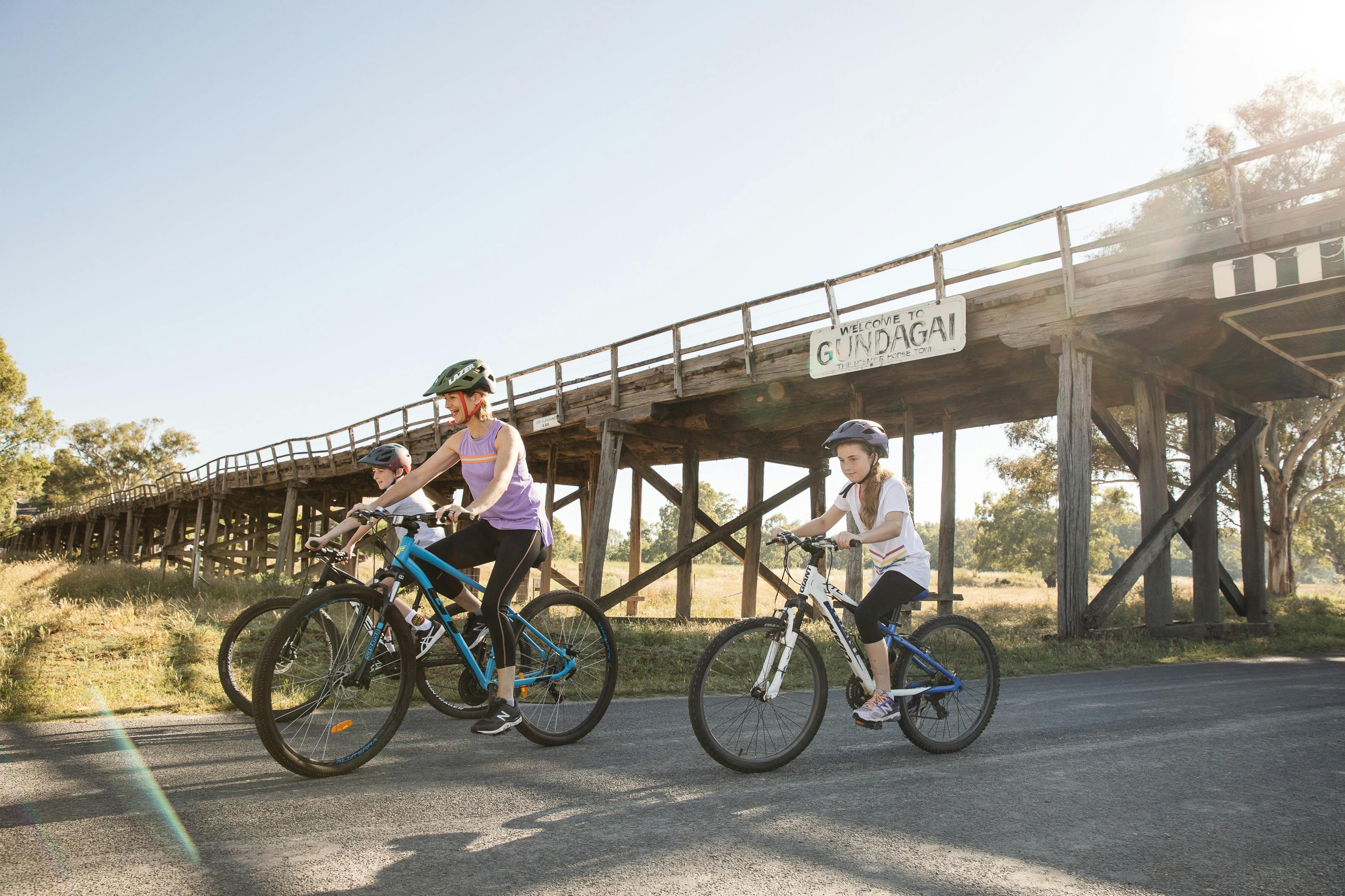 Bike riders under the bridge