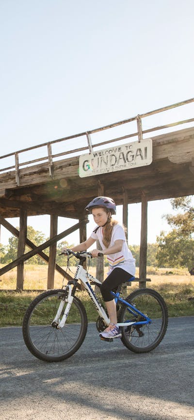 Bike riders under the bridge