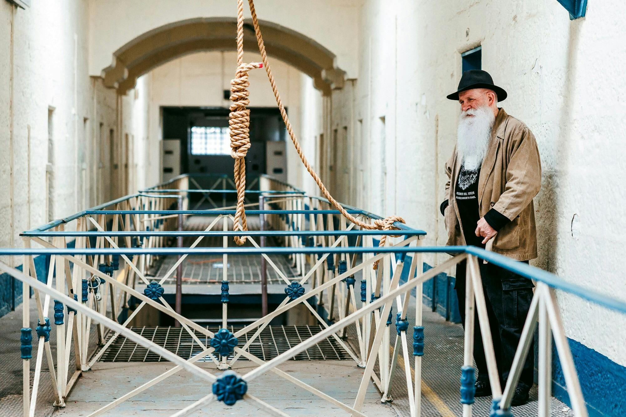 Man standing next to gallows
