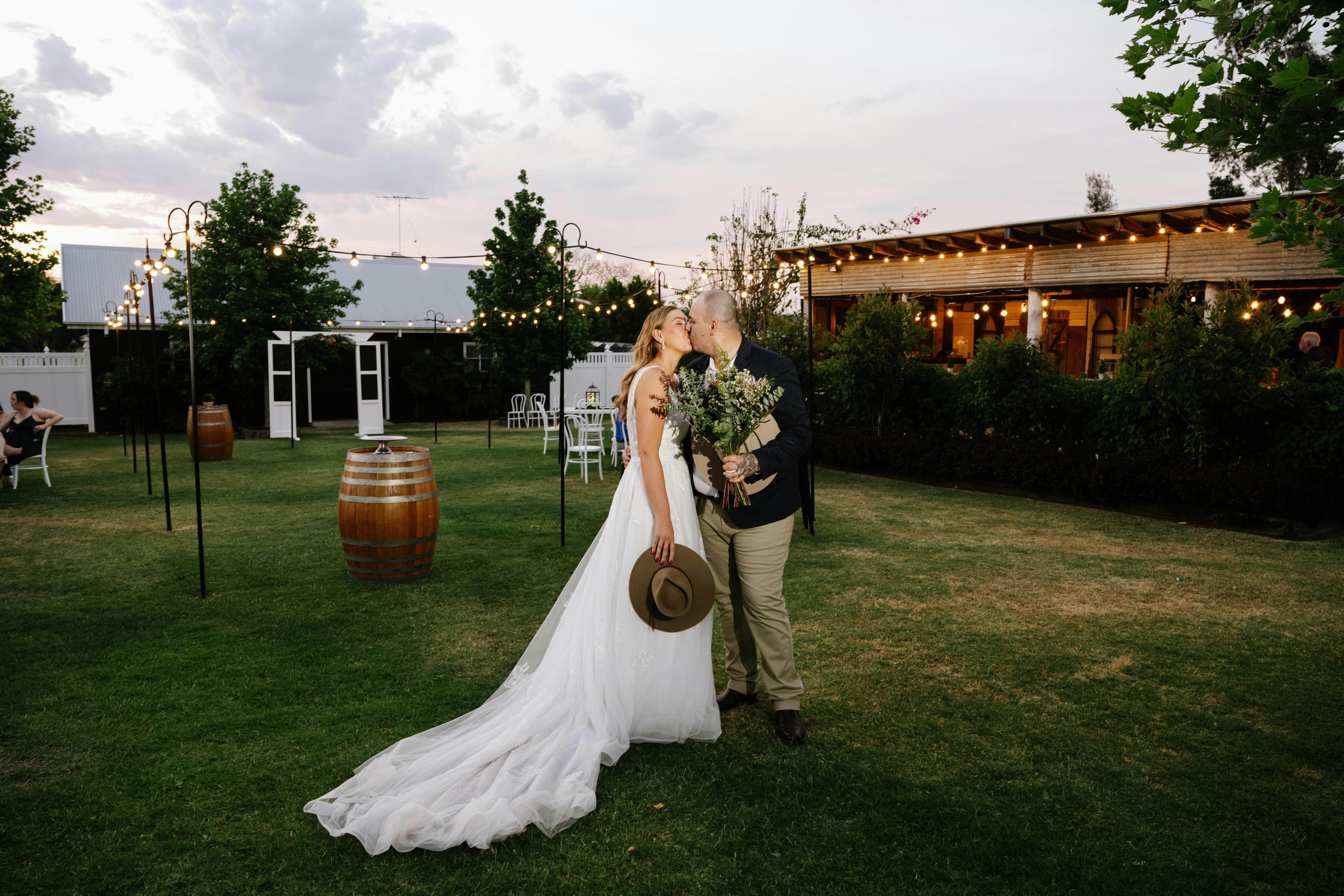 couple outside the barn bar