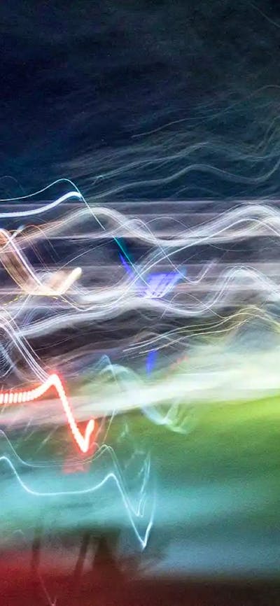 a long exposure image of moving lights