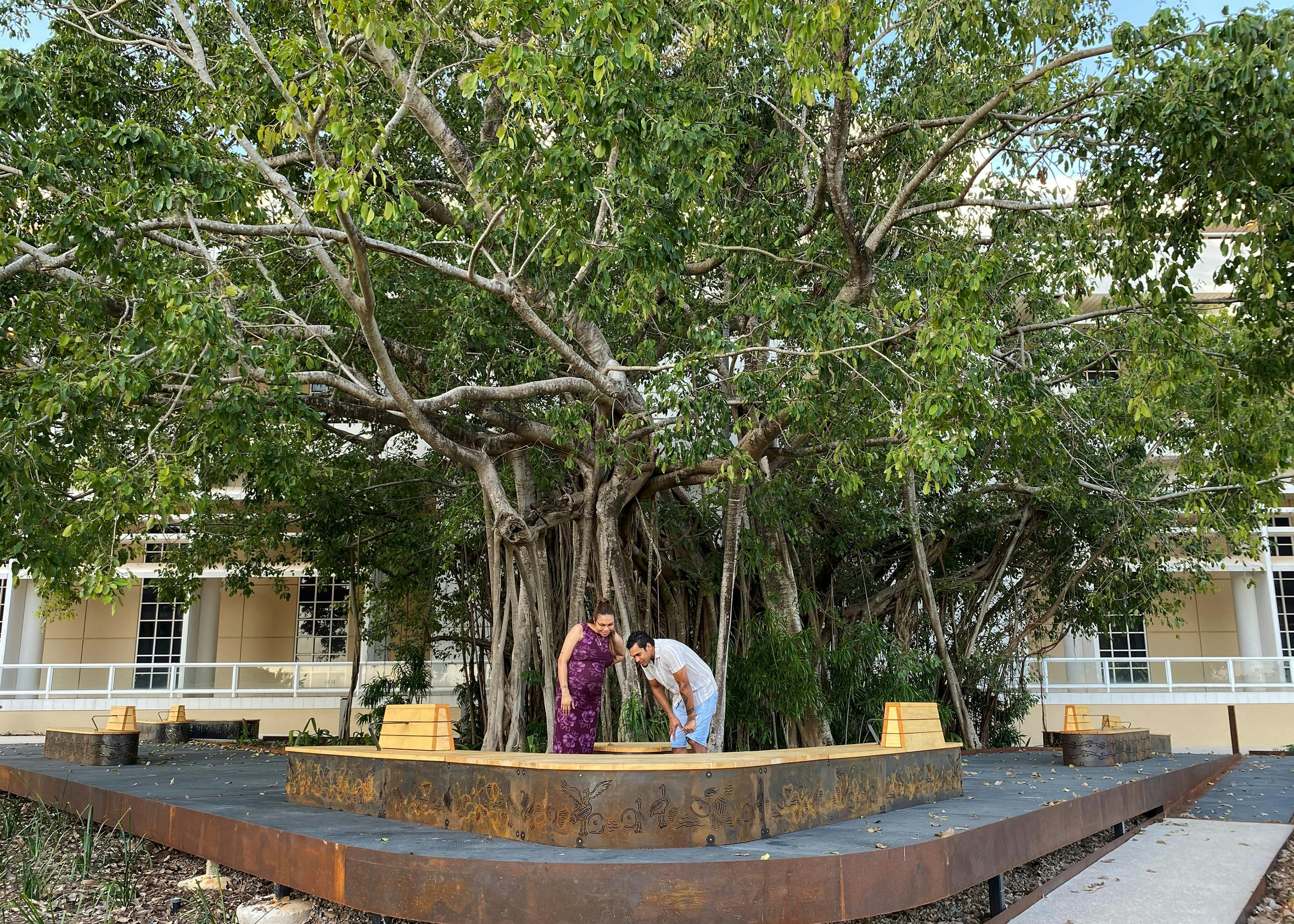 Larrakia/Mayalli artist Keelan Fejo and Brittany with his artwork at Liberty Square