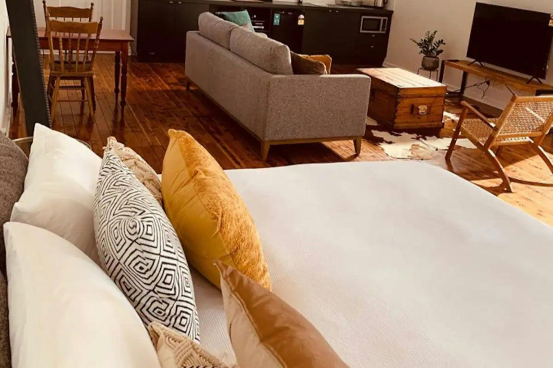 Bed with lounge in background