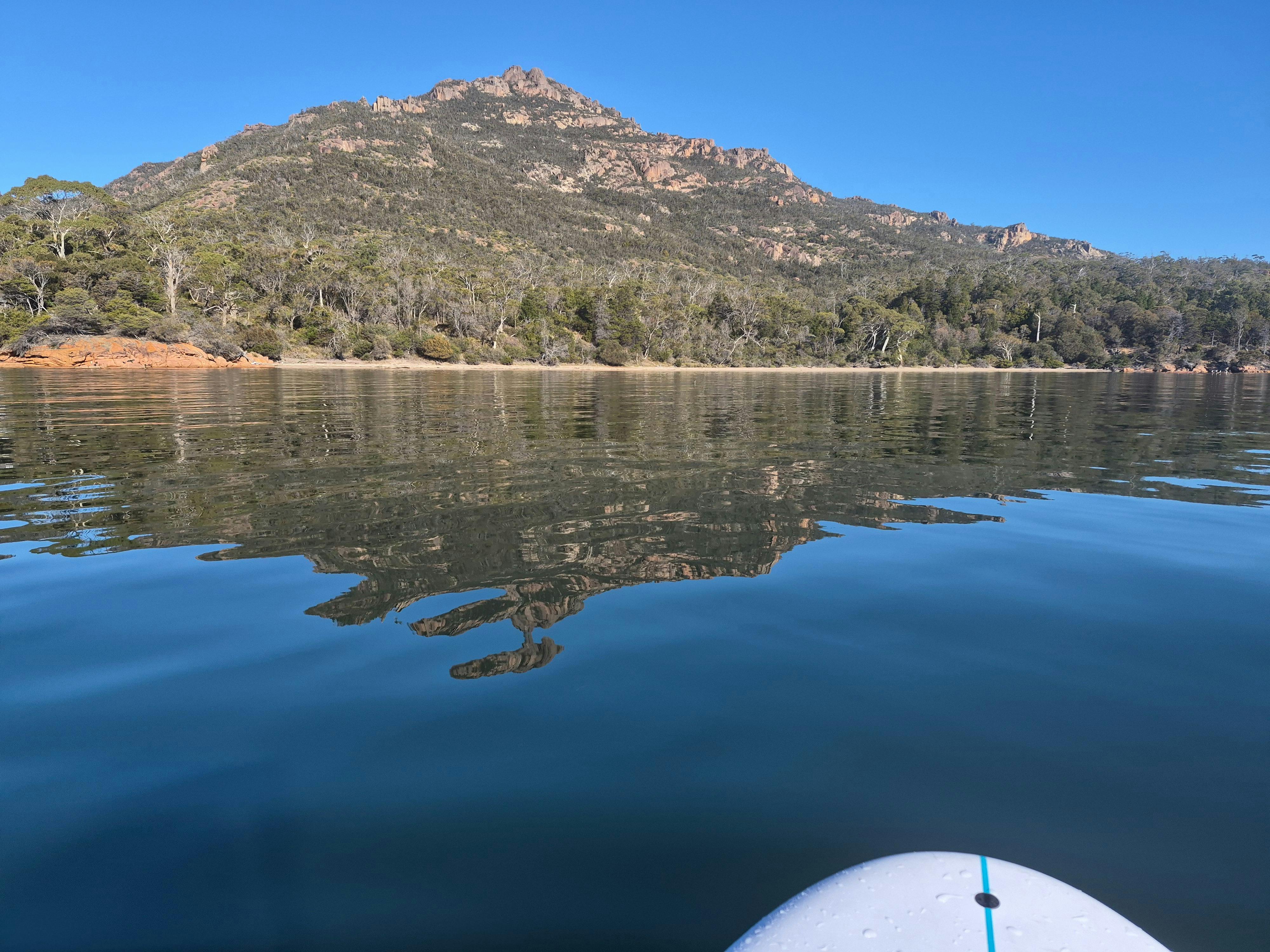 Paddleboarding to a secluded cove in Coles Bay