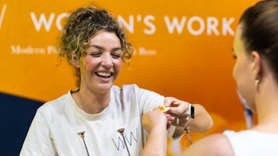 Women's Work serving a customer