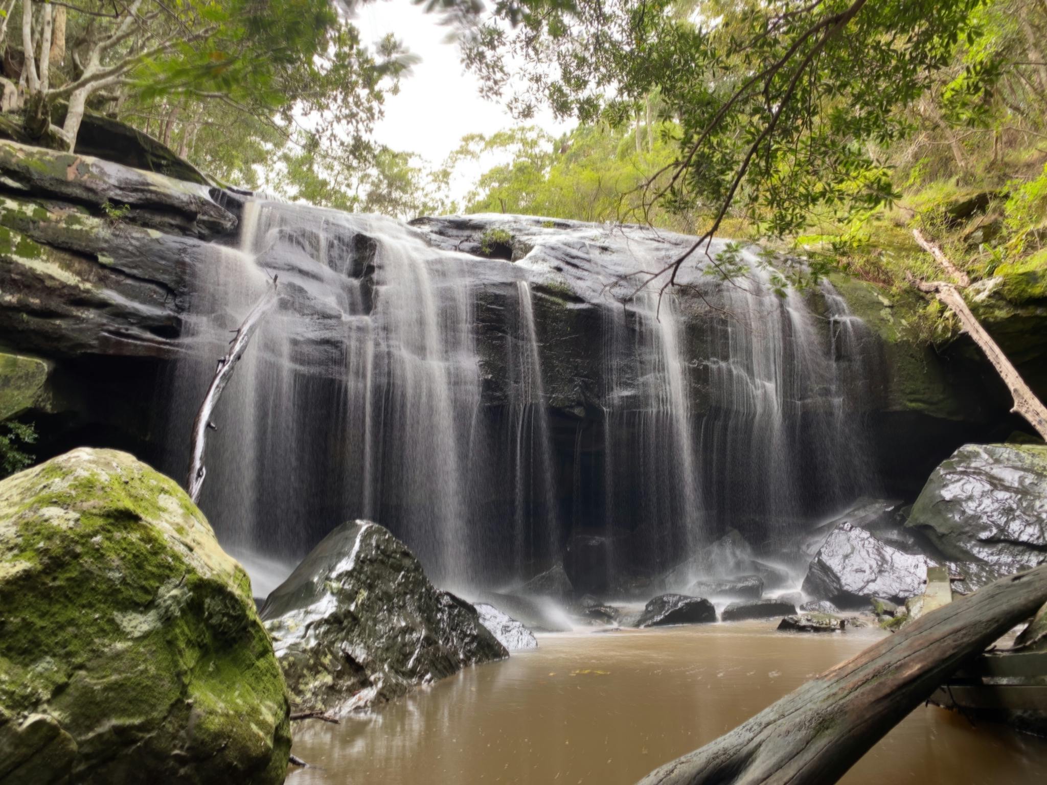 A waterfall on Little Flaggy Creek, with a curtain of water tumbling 4m over a sandstone cliff