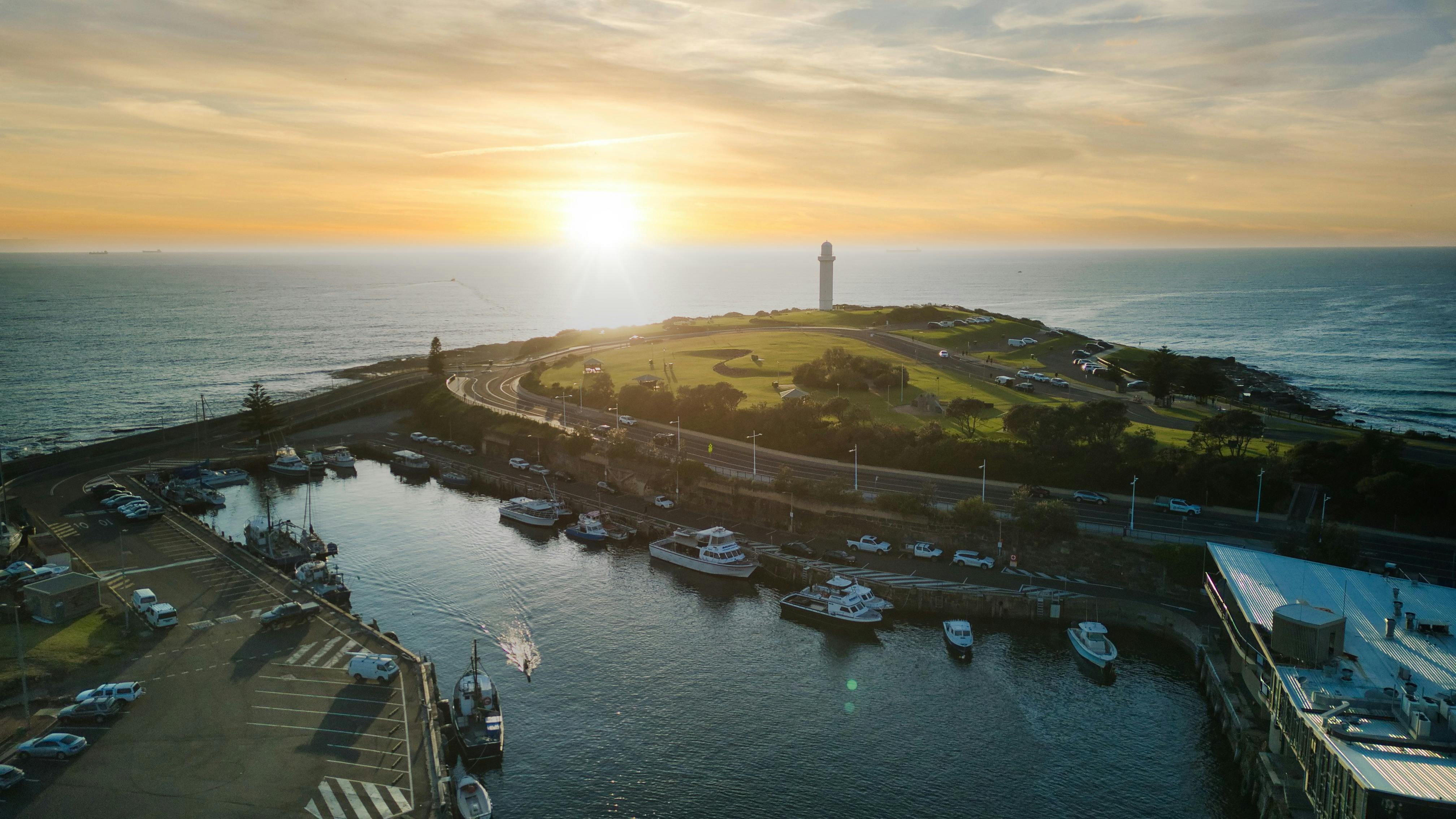 Drone shot of Wollongong Harbour against the sunrise