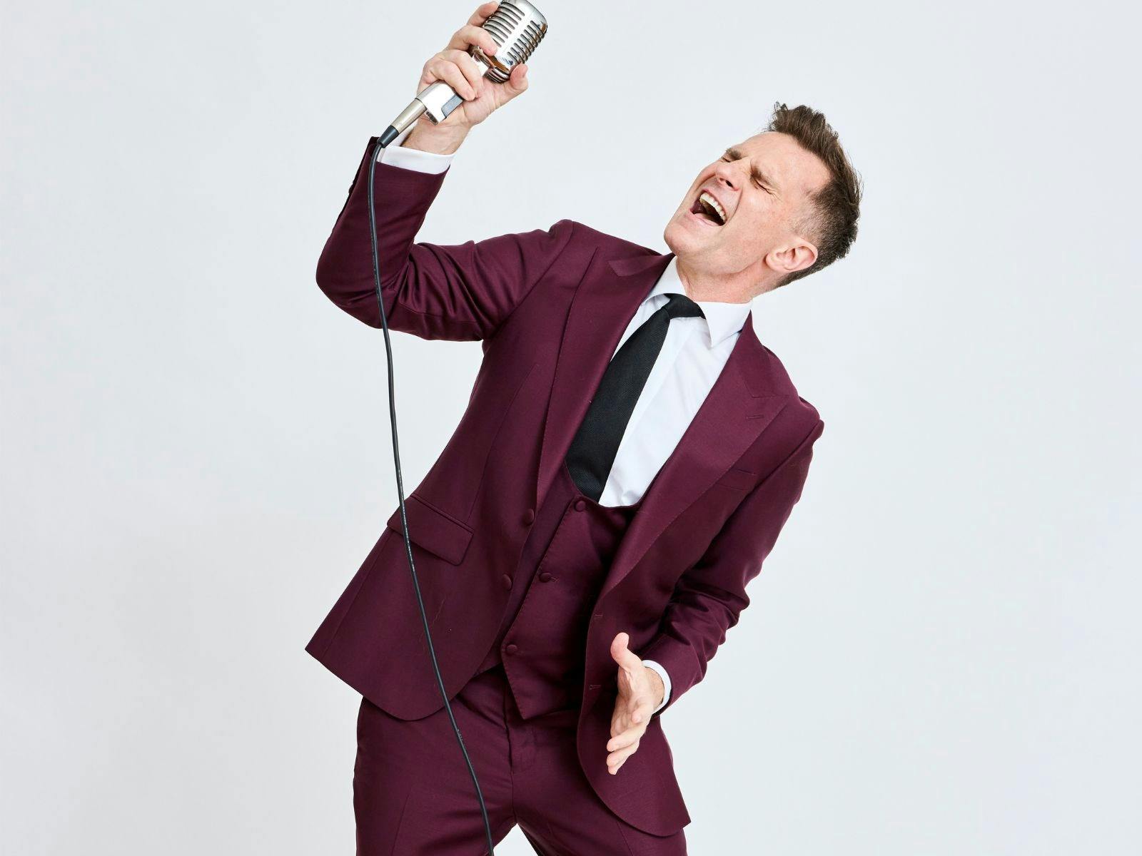 David with an old fashion microphone singing David with an old fashion microphone singing