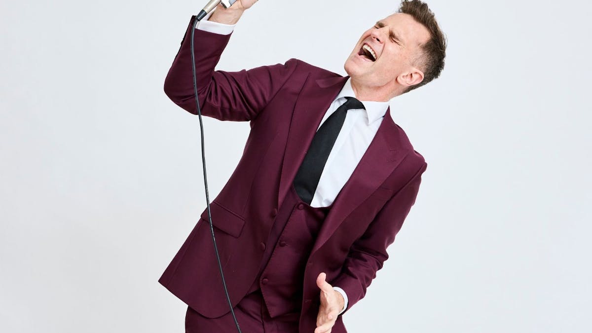 David with an old fashion microphone singing