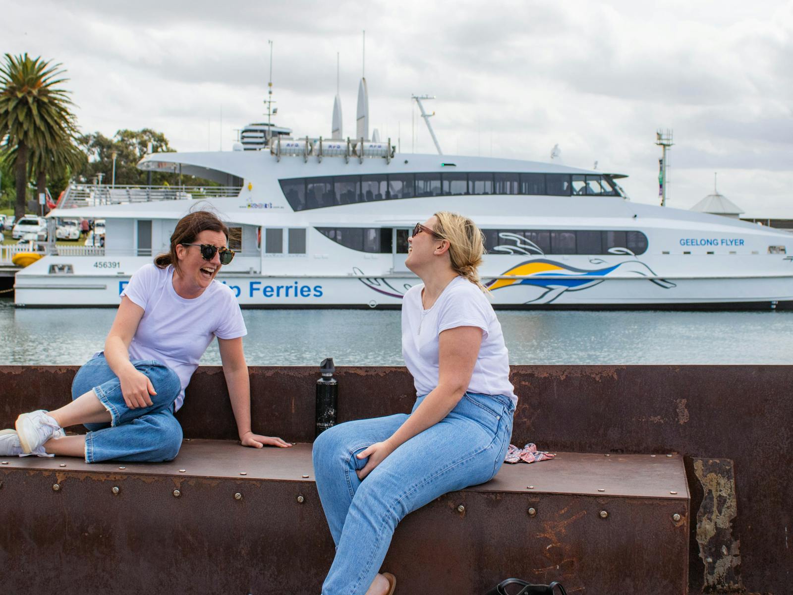 Passengers enjoying Geelong’s waterfront with ferry Geelong Flyer in the background